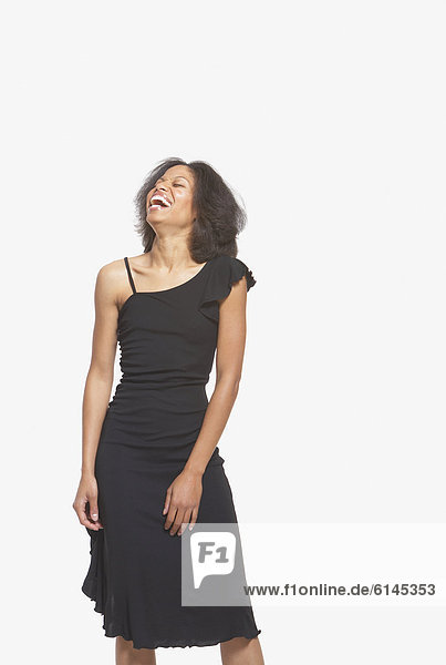 Woman in black gown laughing