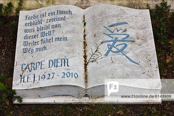 Stone book inscribed with carpe diem at the Historical Cemetery in Weimar  Thuringia  Germany  Europe