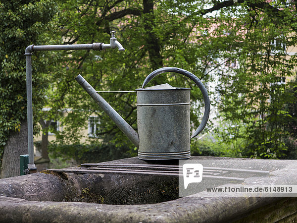Watering can at the Historical Cemetery in Weimar  Thuringia  Germany  Europe