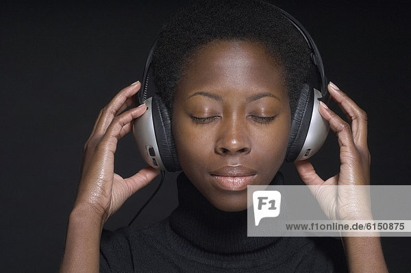 Portrait of African woman wearing headphones