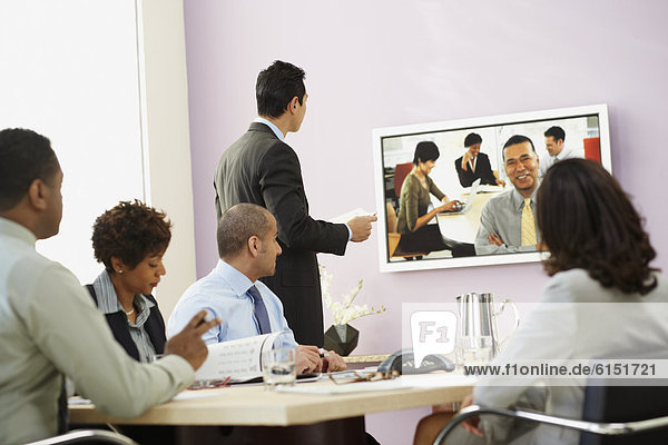 Multi-ethnic businesspeople having video conference