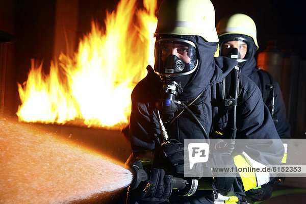 Firefighters training in a house fire  professional firefighters from the Berufsfeuerwehr Essen  Essen  North Rhine-Westphalia  Germany  Europe