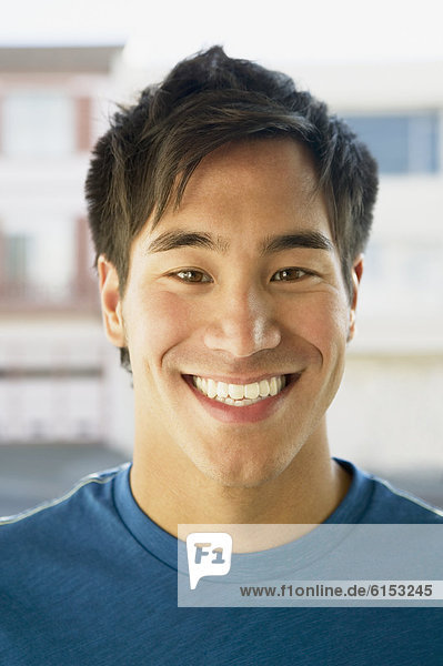 Close up of Asian man smiling