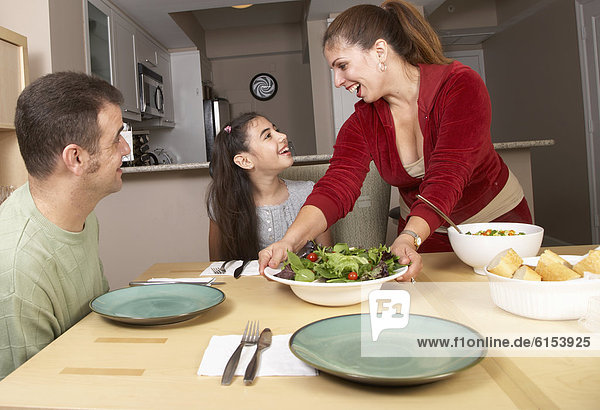 Hispanic family at dinner table
