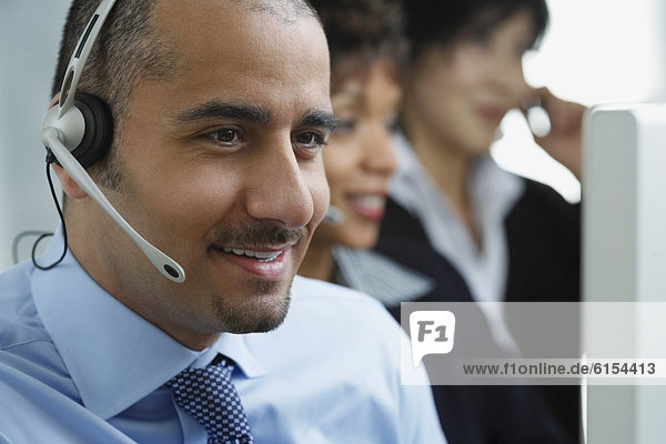 Middle Eastern businessman wearing headset