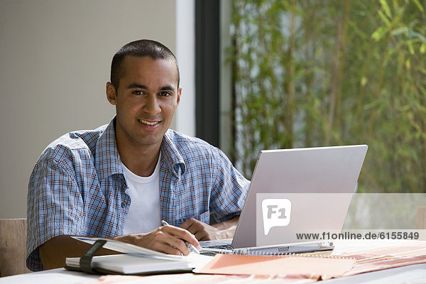 Young businessman working from home
