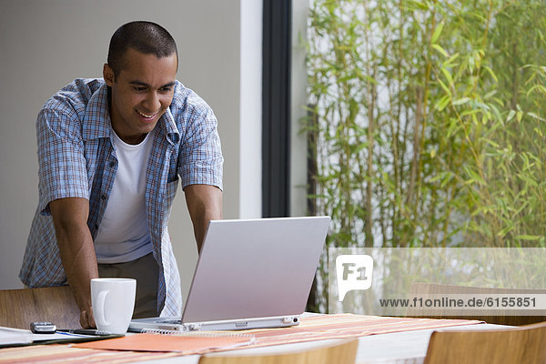 Young businessman working from home