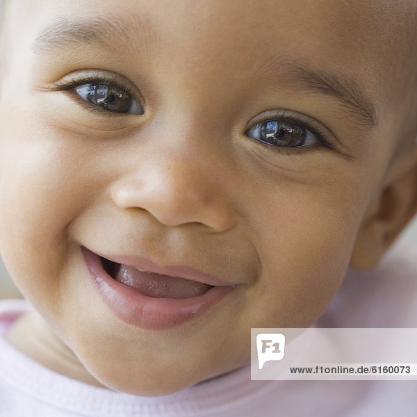 Close up of African American baby smiling