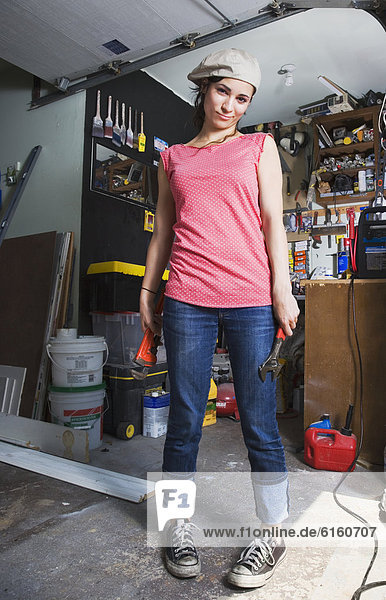 Middle Eastern woman in home workshop