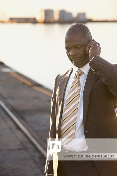 African American businessman talking on cell phone