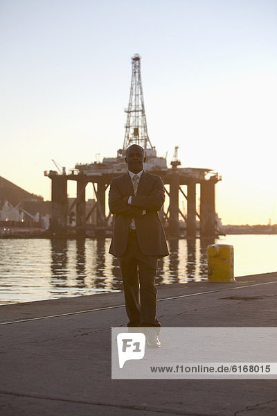 African American businessman on commercial pier