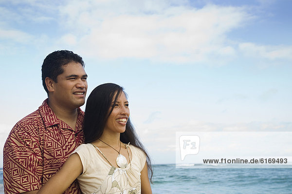 Pacific Islander couple at beach