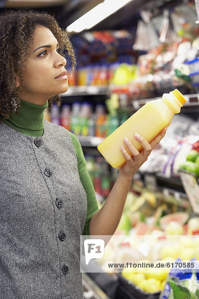 African woman in grocery store