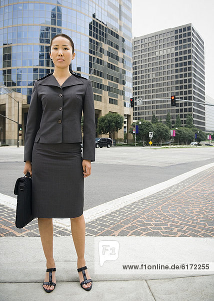 Asian businesswoman in urban area