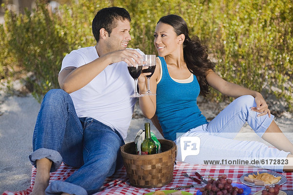 Hispanic couple having picnic