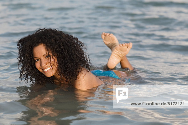 Hispanic woman in water