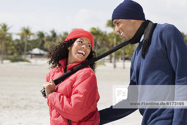 Multi-ethnic couple smiling at each other