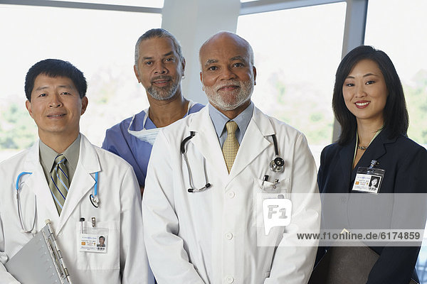 Group of doctors with Asian businesswoman