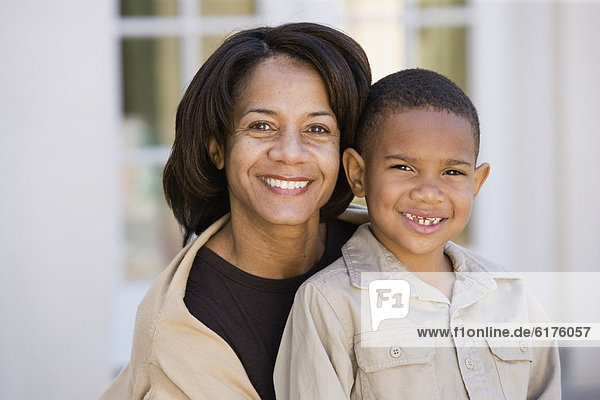 African American mother and son smiling