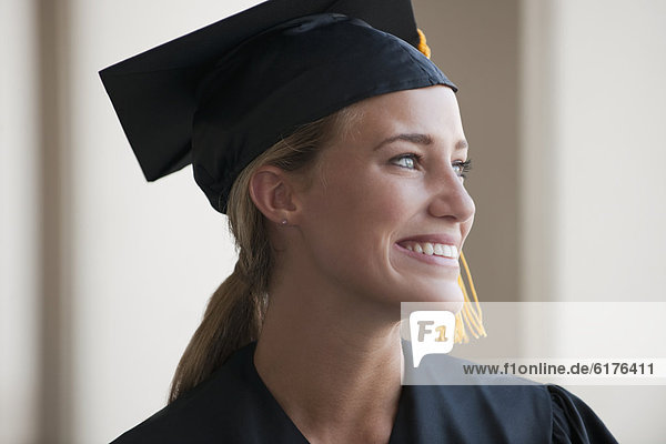 Caucasian graduate in cap and gown