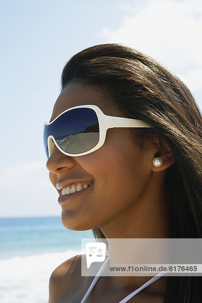 Hispanic woman wearing sunglasses