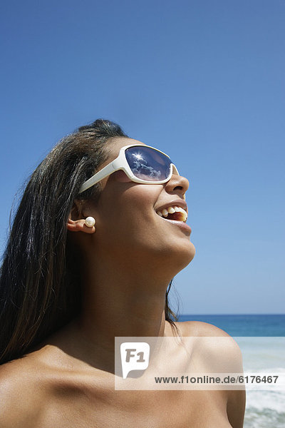 Hispanic woman wearing sunglasses