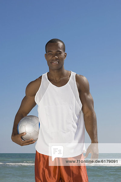 Mann  halten  Volleyball