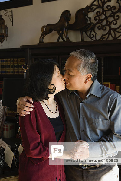 Asian couple kissing