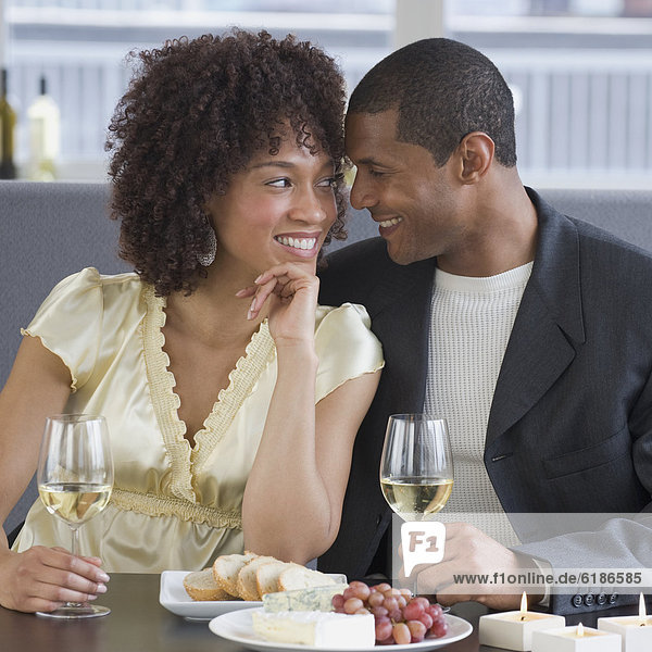 African couple dining at restaurant