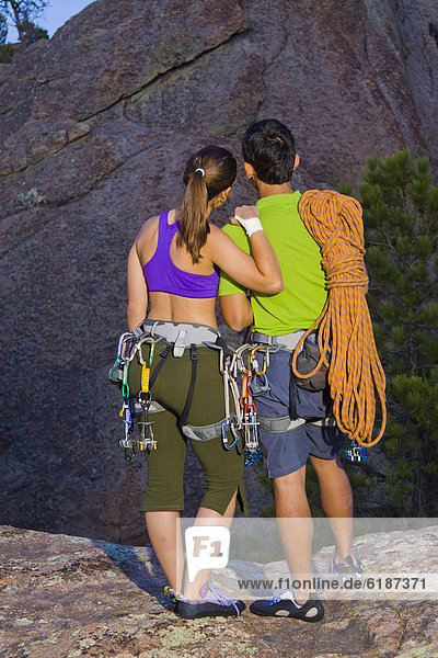 Couple preparing for rock climbing