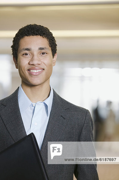 Mixed race businessman smiling