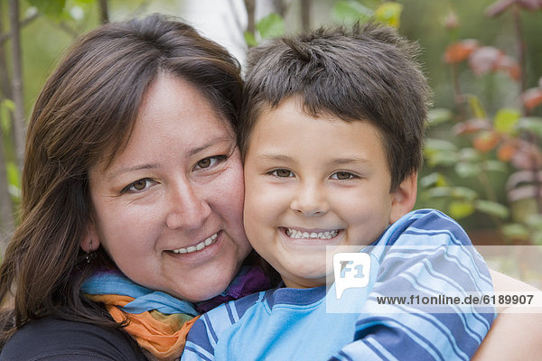Chilean mother hugging son