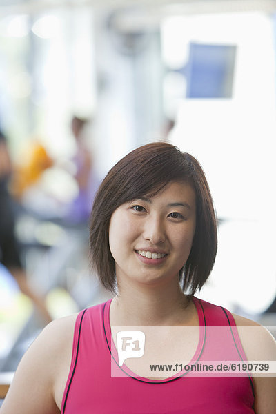 Smiling Korean woman in health club