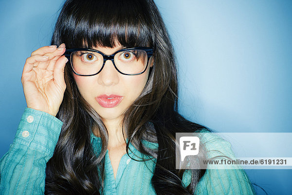 Serious mixed race woman in eyeglasses