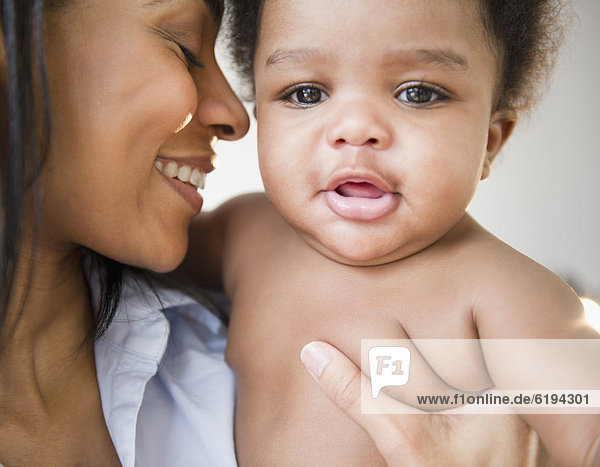 African American mother holding baby boy