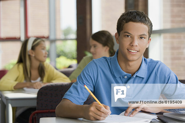Mixed race teenager doing homework