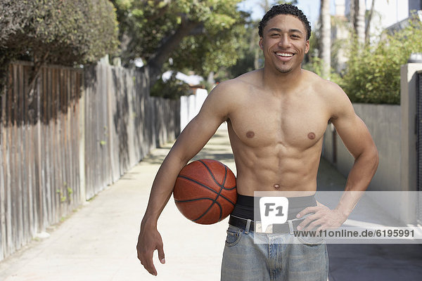 Mann  halten  mischen  Basketball  jung  Freier Oberkörper  nackt  Mixed
