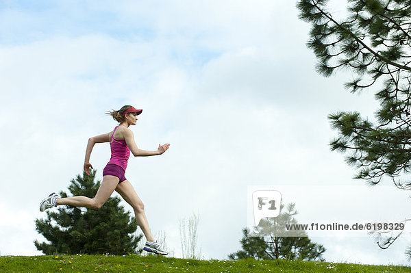 Mixed race woman running outdoors