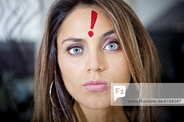 Hispanic woman with exclamation mark on her forehead