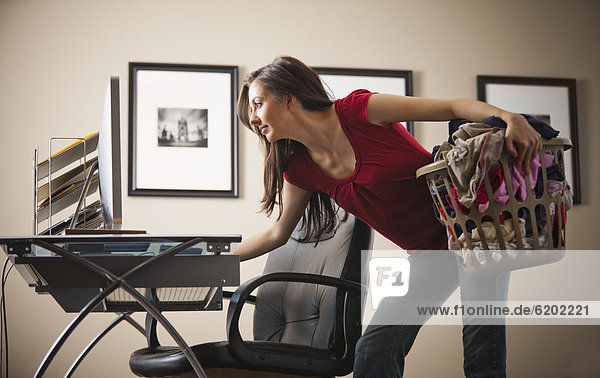 Caucasian woman multi-tasking home office