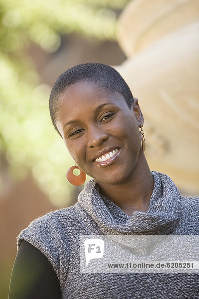 Smiling African woman outdoors
