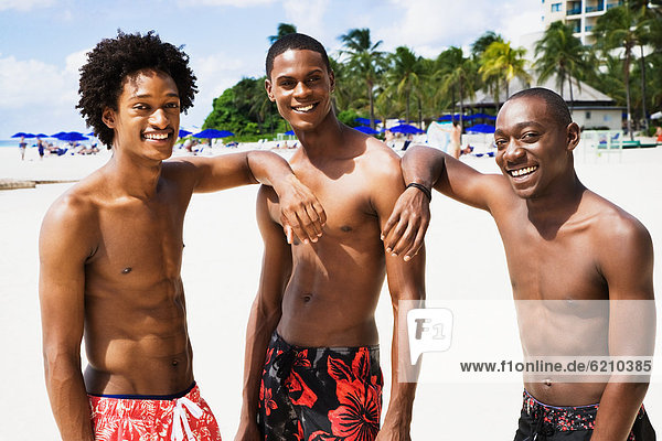 African men smiling on beach