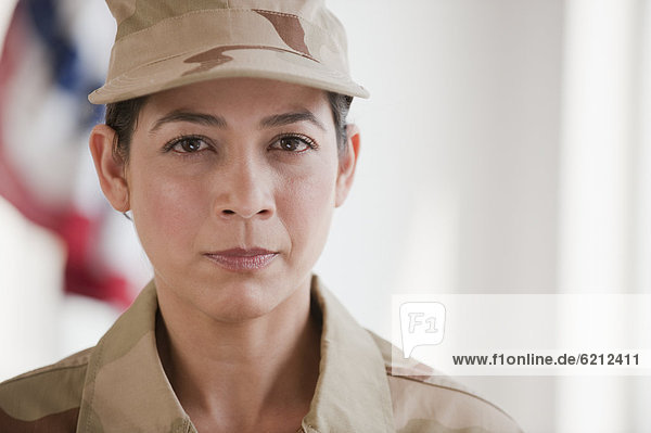 Hispanic woman in army uniform