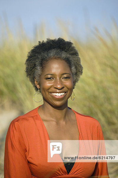 Smiling African woman at beach