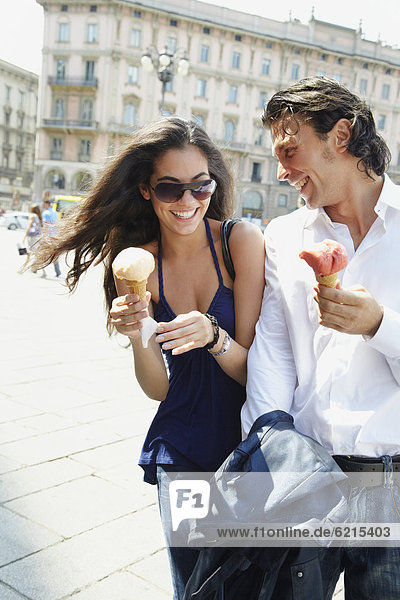 Couple eating ice cream cones