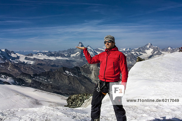 Mountain climber standing on the Feejoch ridge  Saas Fee  canton of Valais  Alps  Switzerland  Europe