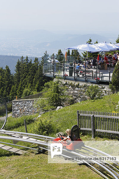 'Terrace of Stubenberghaus  inn  and bobsleigh run ''Hexenexpress''  Mt Schoeckl  Sankt Radegund near Graz  Grazer Bergland region  Styria  Austria  Europe  PublicGround'