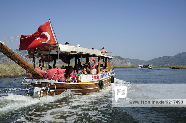 Excursion boat on a river  river delta in the nature preservation area between Caunos and Iztuzu Beach  Dalyan  Mugla Province  Turkey  Asia Minor