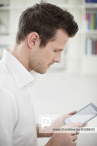 Man using an electronic book