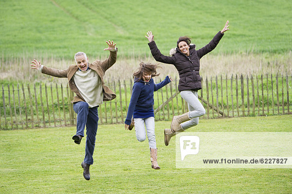 Happy family having fun in a field